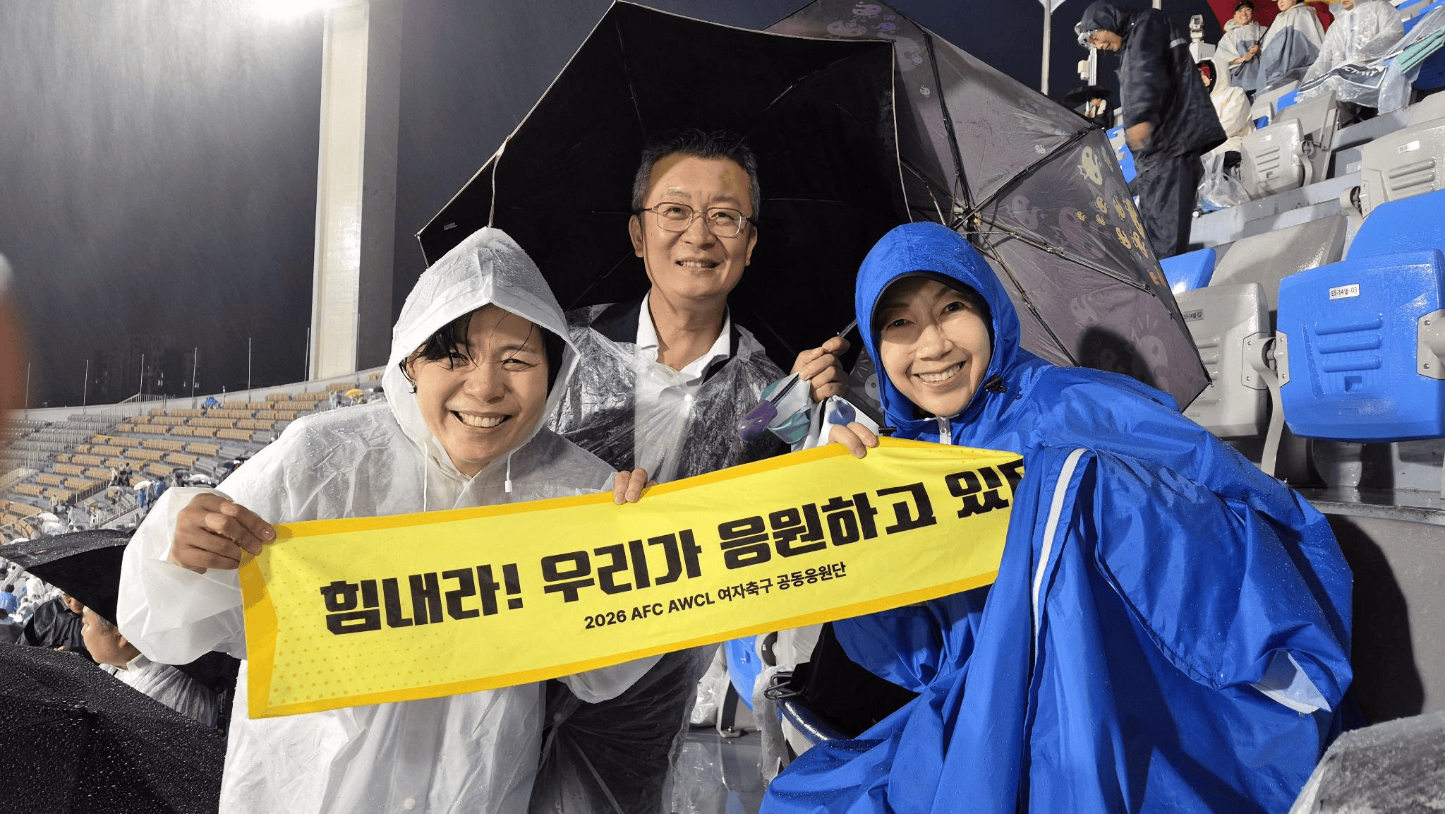 Youngmi Cho (left) with fellow peace civic society activists at the Naegoyang versus Suwon FC match